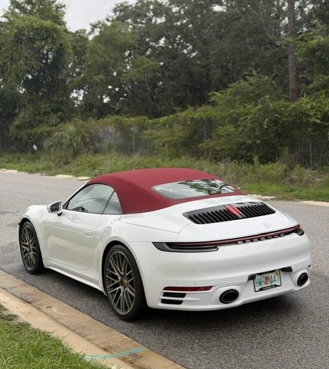 rear view of a White Porsche 911 Carrera Cabriolet after being professionally detailed