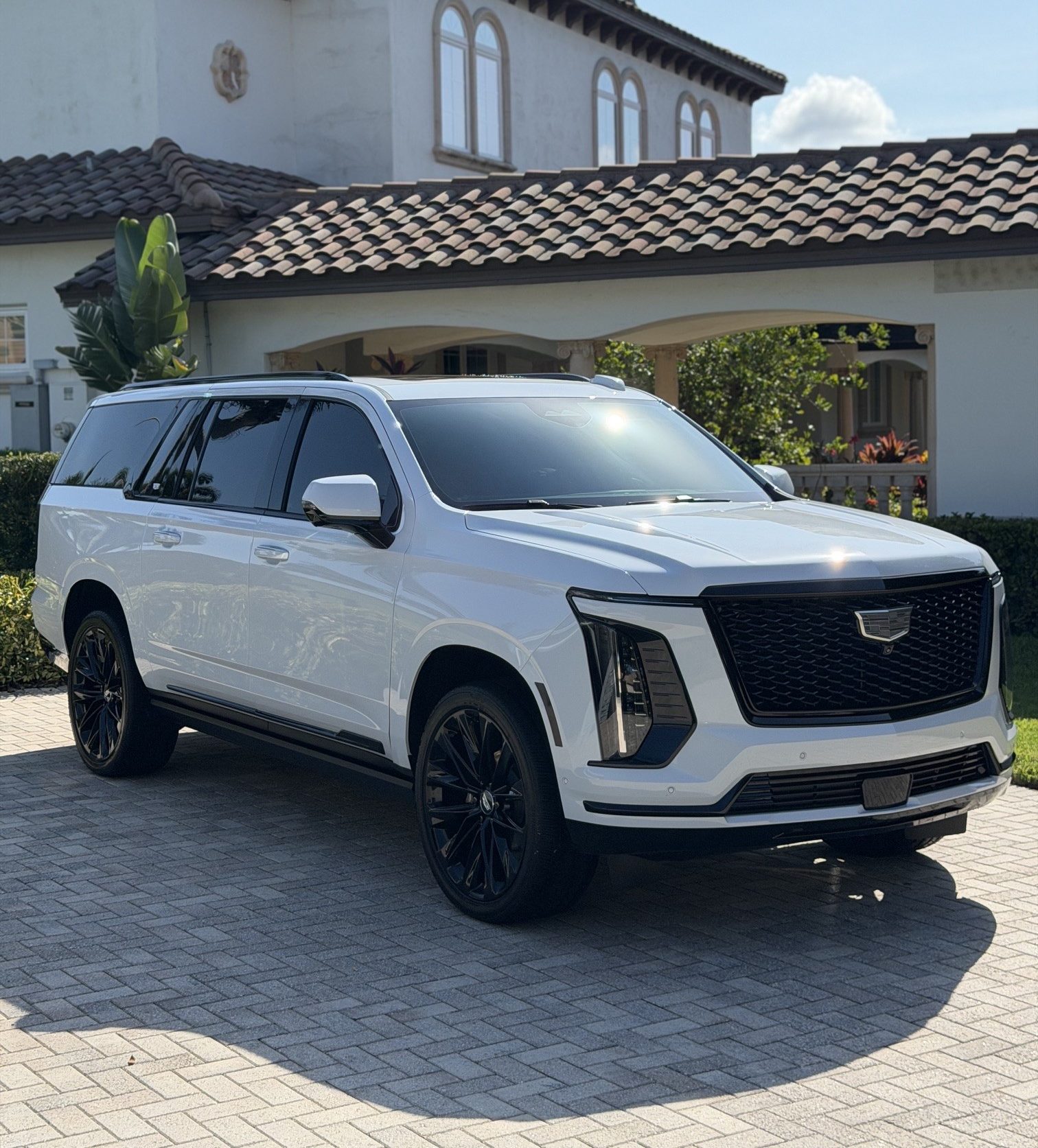 White Cadillac Escalade after our mobile detailing team freshly washed and detailed this SUV in Clearwater